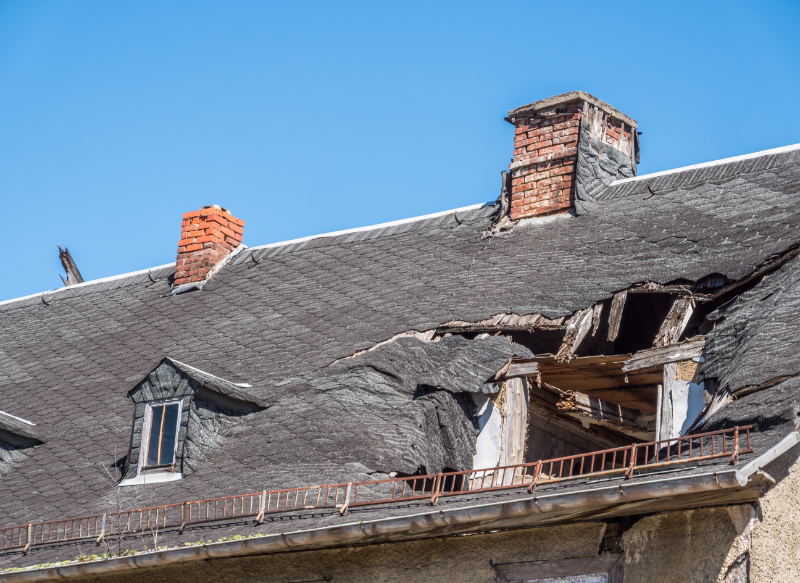 A roof damaged by a destructive storm