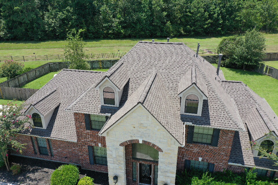 Residential home with new brown shingles