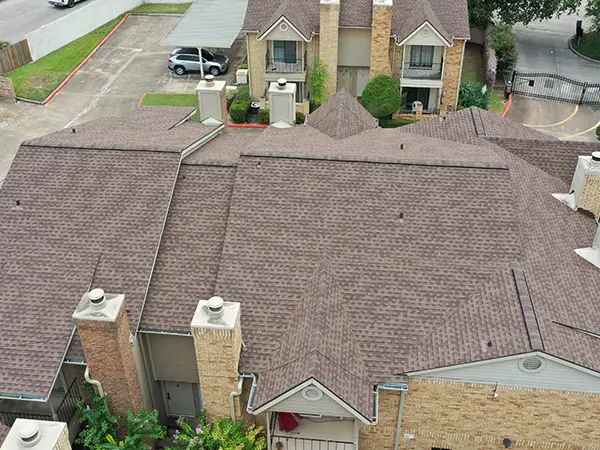 Lone Star Roofing crew installing a new asphalt shingle roof on a residential home in Houston TX