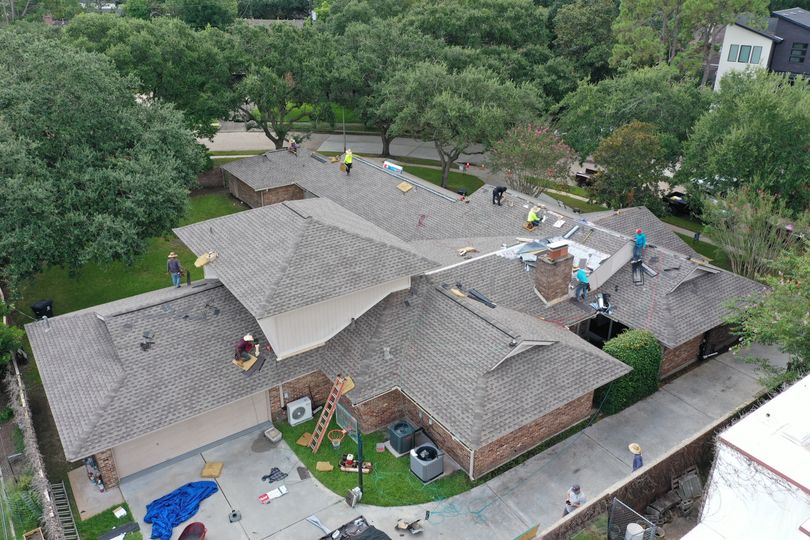 A group of roofer fixing a residential roof