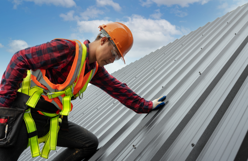 A roofer conducting a roof inspection