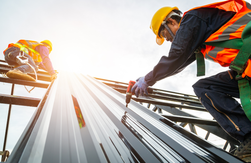Two working roofing contractors