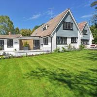 Steep-gabled house with a freshly installed shingle roof and dormer windows
